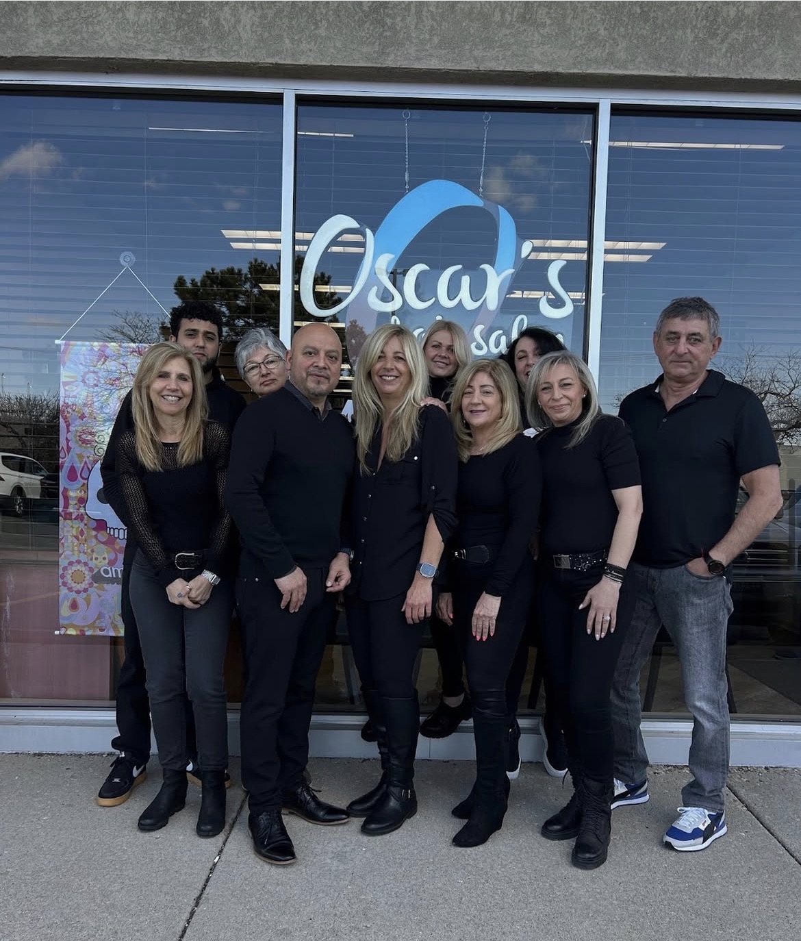 The Oscar's Hair Salon team outside the shop
